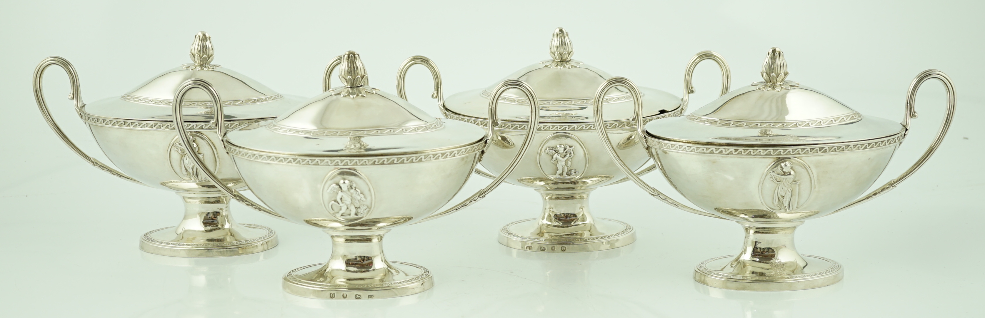 A good set of four George III silver oval pedestal sauce tureen's and covers